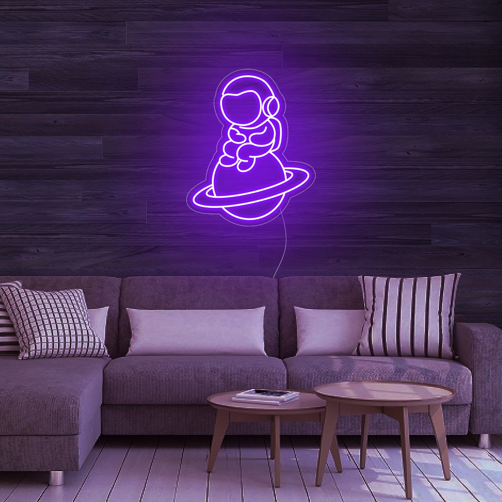 Astronaut Sitting on Planet - LED Neon Signs