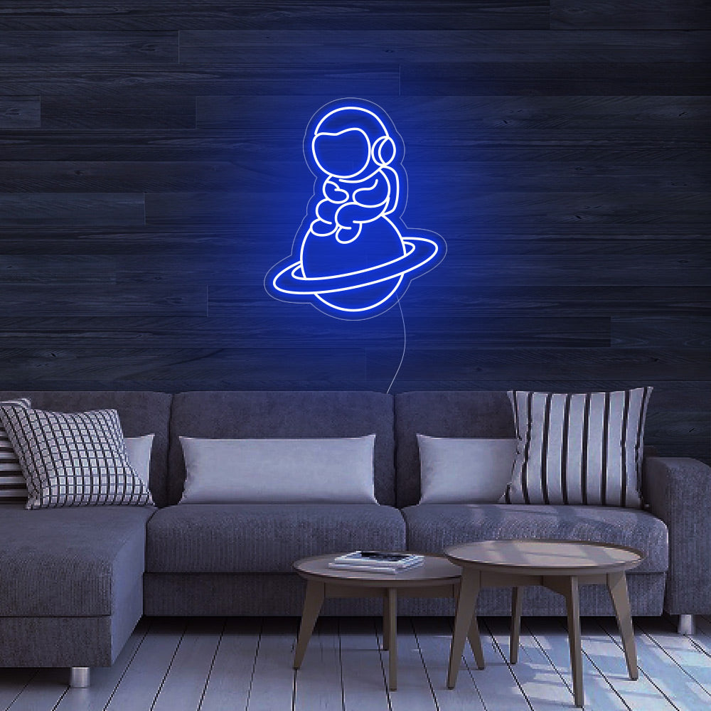 Astronaut Sitting on Planet - LED Neon Signs