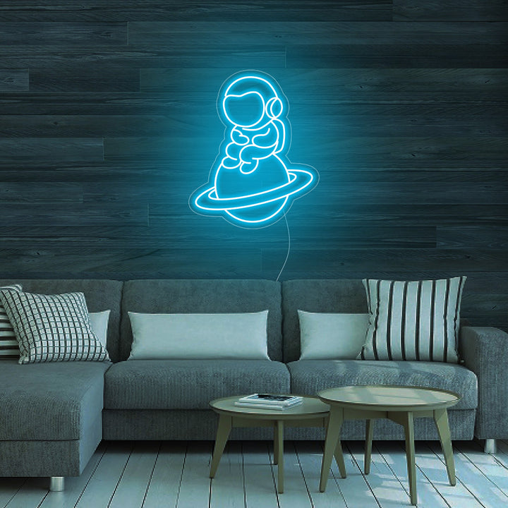 Astronaut Sitting on Planet - LED Neon Signs